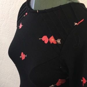 Black knit “heartbreaker” dress